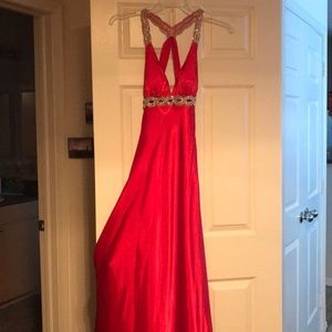 Long red gown with open back. Size 1.